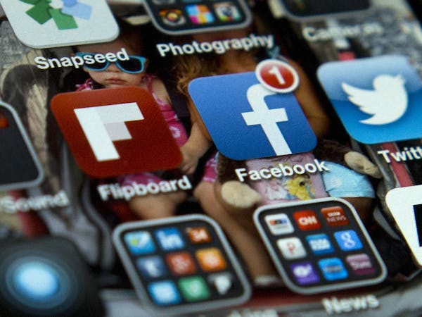 Social media app icons, including for Facebook and Twitter, on an iPhone.