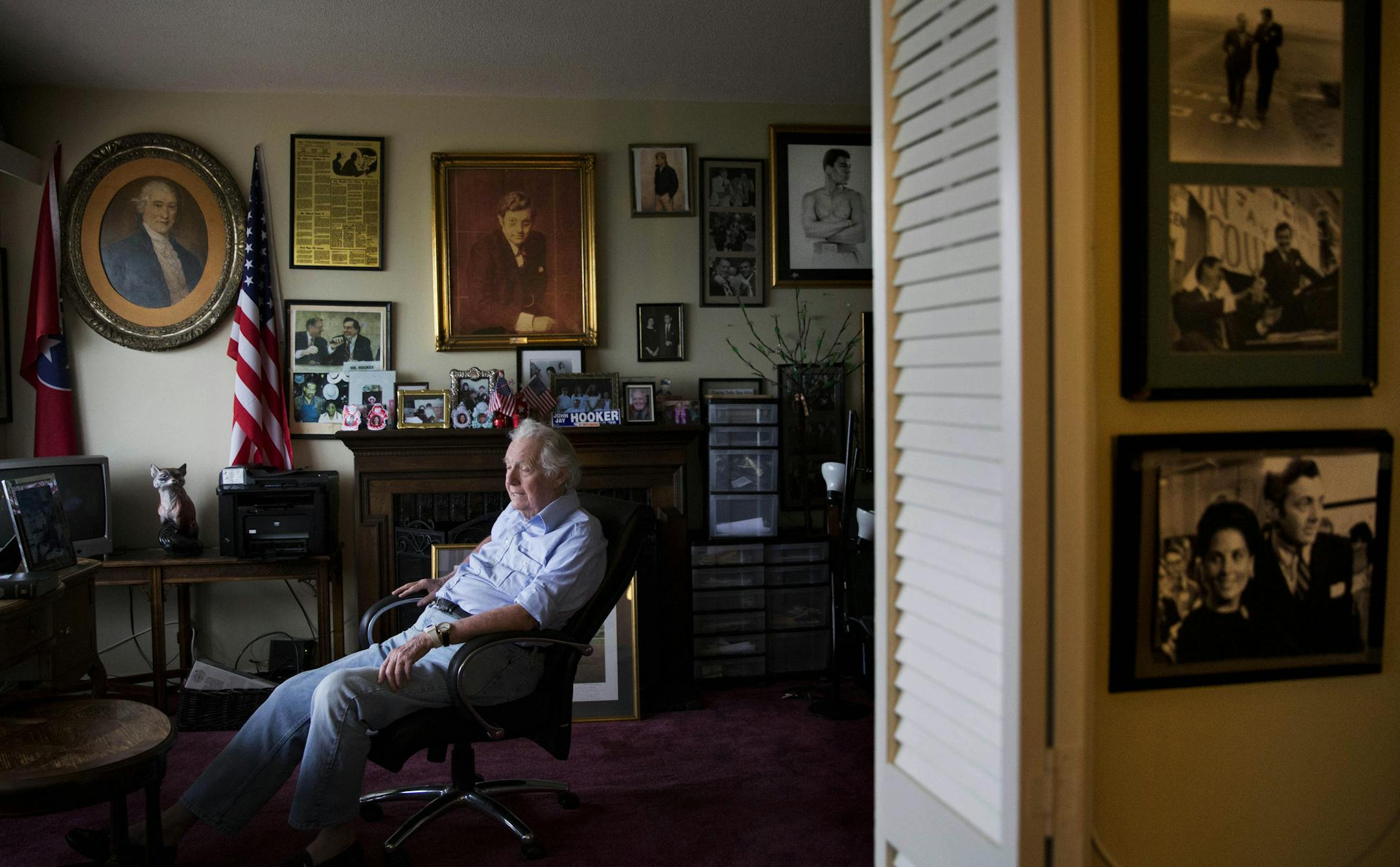In this photo taken Aug. 19, 2015, John Jay Hooker sits in his retirement home apartment as a 200-year-old oil portrait of his ancestor William Blount, a signer of the U.S. Constitution, hangs at left in Nashville, Tenn. Friend of Muhammad Ali, socialite, lawyer who moved in the Kennedys’ circle, Hooker also lost businesses, millions of dollars and three high-profile political campaigns. In his later years, he has earned the moniker gadfly, mostly for losing battles, and seemed to be fadi
