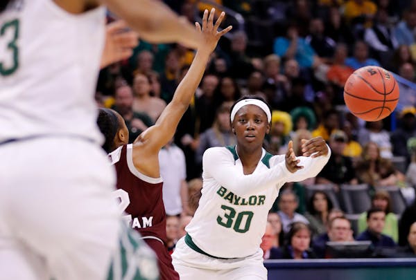 Baylor's Alexis Jones (30) passes the ball during the first half of a regional final of the NCAA women's college basketball tournament against Mississ