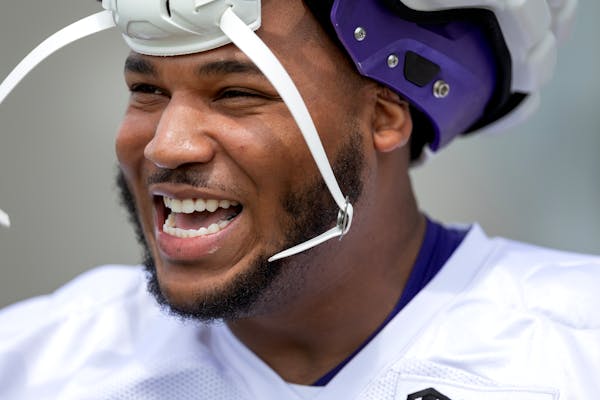 Minnesota Vikings offensive tackle Christian Darrisaw (71) walked out for practice Thursday, July 27, 2023, at TCO Performance Center in Eagan, Minn. 