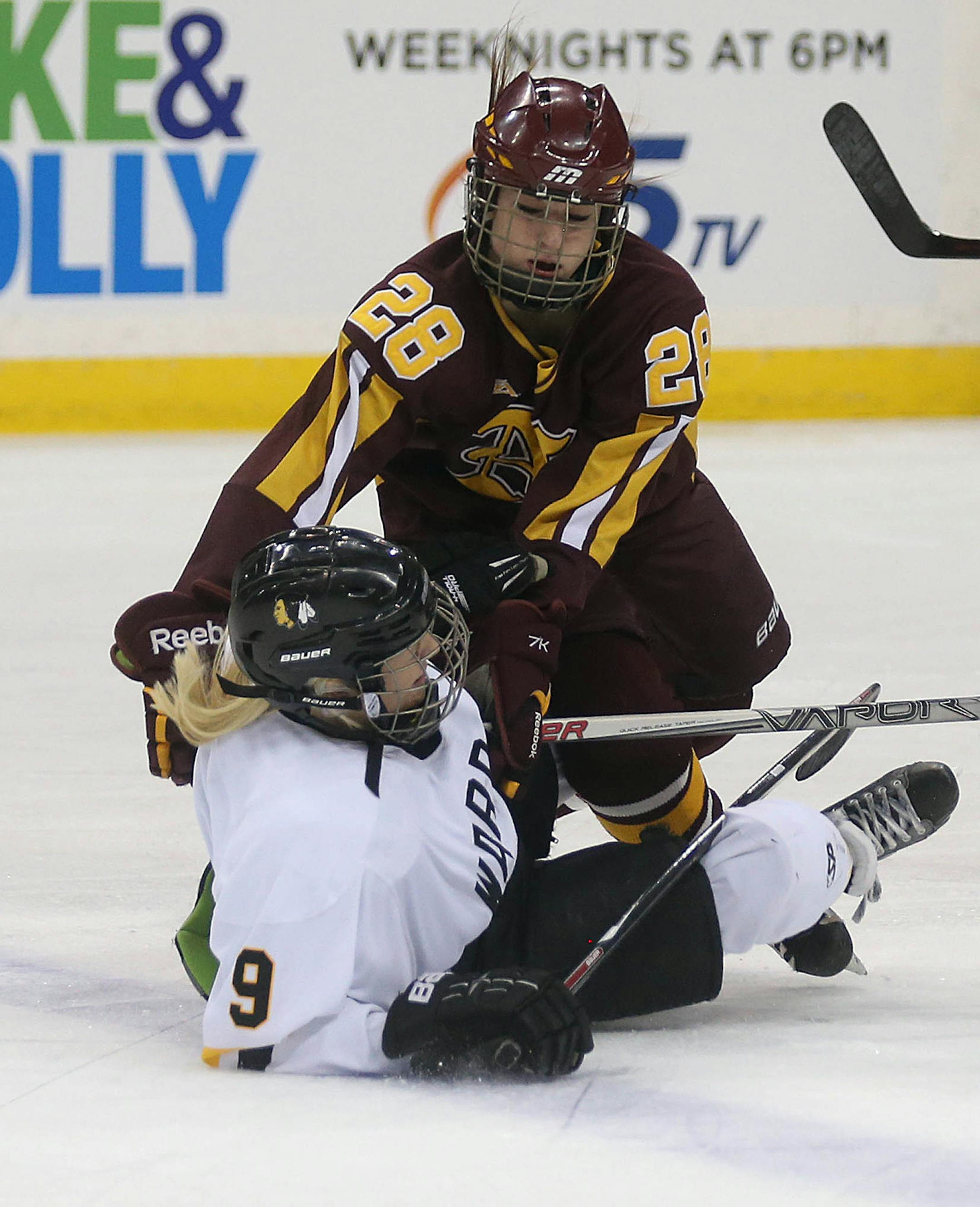 Northfieldís Anne Hargis (top) collided with Warroadís Brooke Hellquist in the first period.] JIM GEHRZ ï james.gehrz@startribune.com / St. Paul, MN / February 17, 2016 /11:00 AM ñ BACKGROUND INFORMATION: Northfield High School played Warroad in the Class 1A quarterfinals at the Xcel Energy Center at the 2016 Girls' hockey state tournament.