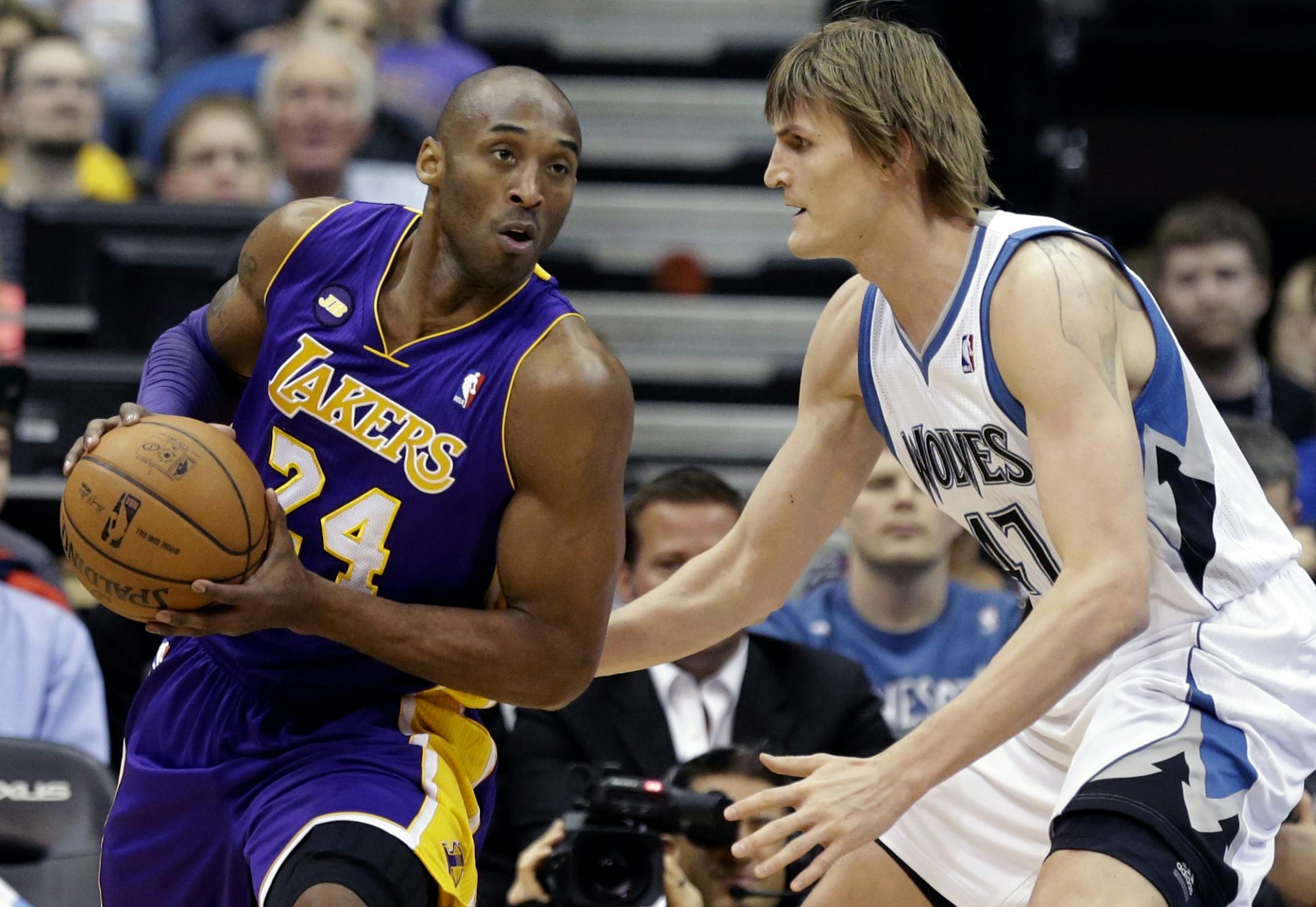 Kobe Bryant drives around the Timberwolves' Andrei Kirilenko