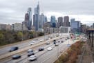 FILE - In this March 31, 2021 file photo, traffic moves along the Interstate 76 highway in Philadelphia. If you're traveling over the Memorial Day wee