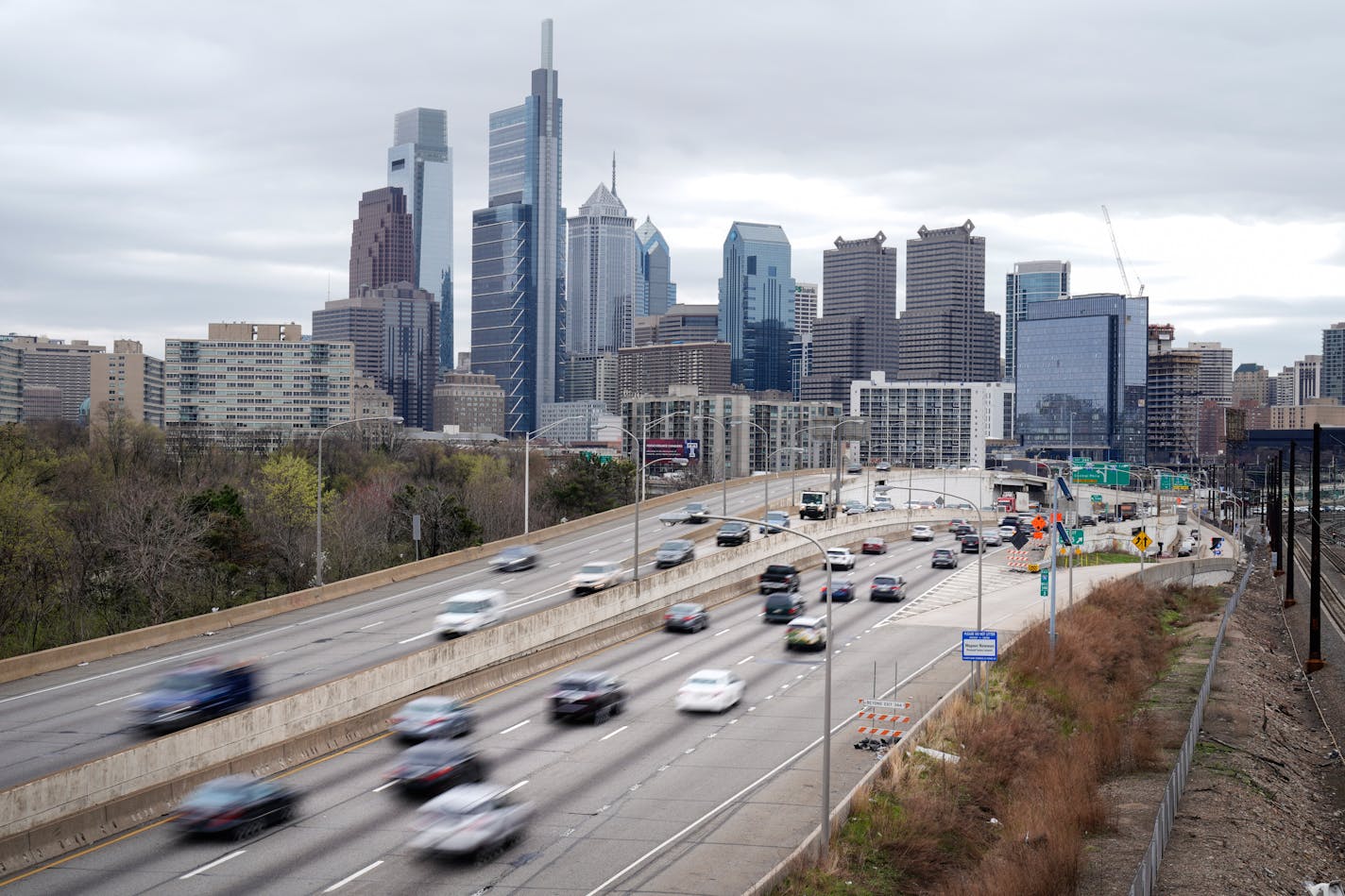 FILE - In this March 31, 2021 file photo, traffic moves along the Interstate 76 highway in Philadelphia. If you're traveling over the Memorial Day weekend, expect lots of company. The AAA auto club said Tuesday, May 11, that more than 37 million Americans plan to travel at least 50 miles from home over the holiday weekend. (AP Photo/Matt Rourke, File)