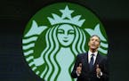 FILE- In this March 19, 2014, file photo, Howard Schultz, chairman and CEO of Starbucks Coffee Company, speaks at the company's annual shareholders me