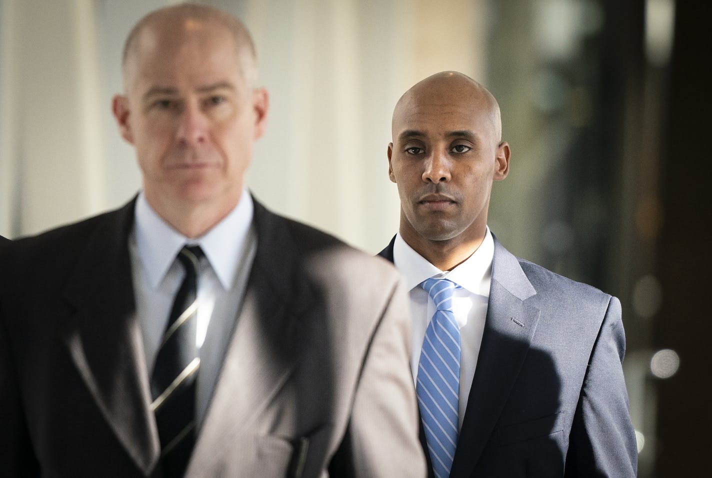 Former Minneapolis police officer Mohamed Noor walks through the skyway with his attorney Thomas Plunkett, left, on the way to court for his second day of testimony is his own defense. ] LEILA NAVIDI &#xa5; leila.navidi@startribune.com BACKGROUND INFORMATION: Former Minneapolis police officer Mohamed Noor walks into the Hennepin County Government Center for the second day of his testimony during his trial for the murder of Justine Ruszczyk Damond in Minneapolis on Friday, April 26, 2019. ORG XMI