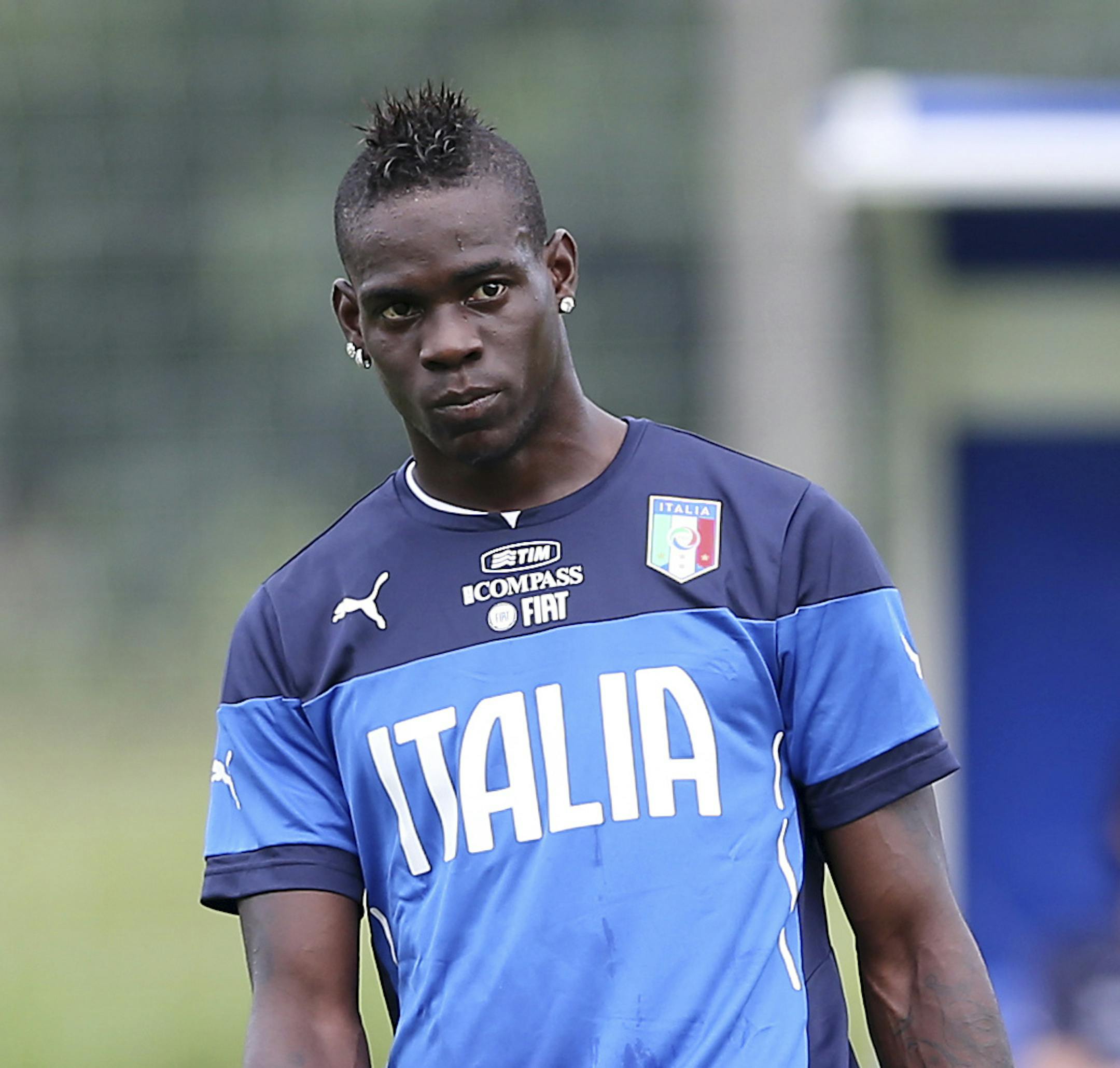Italy forward Mario Balotelli stands during a training session of Italy in Mangaratiba, Brazil, Saturday, June 7, 2014. Italy play in group D of the 2014 soccer World Cup. (AP Photo/Antonio Calanni) ORG XMIT: XAC112