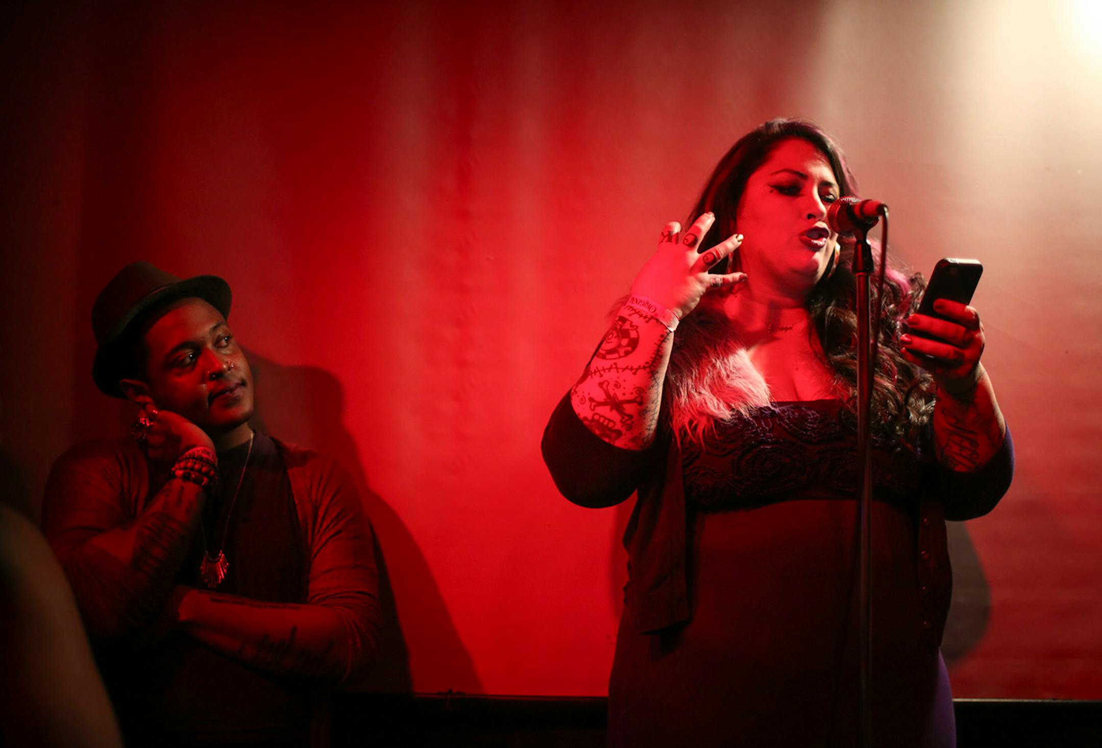 Rachel McKibbens read a poem Wednesday night The Prince Purple Poetry Party held in The Record Room at First Ave. At left was Danez Smith. ] JEFF WHEELER • jeff.wheeler@startribune.com One of the off-site events at the start of the AWP Conference & Bookfair was The Prince Purple Poetry Party Wednesday night, April 8, 2015 in The Record Room at First Ave. in Minneapolis. More than a dozen poets read poems they wrote that were inspired by the music of Prince.