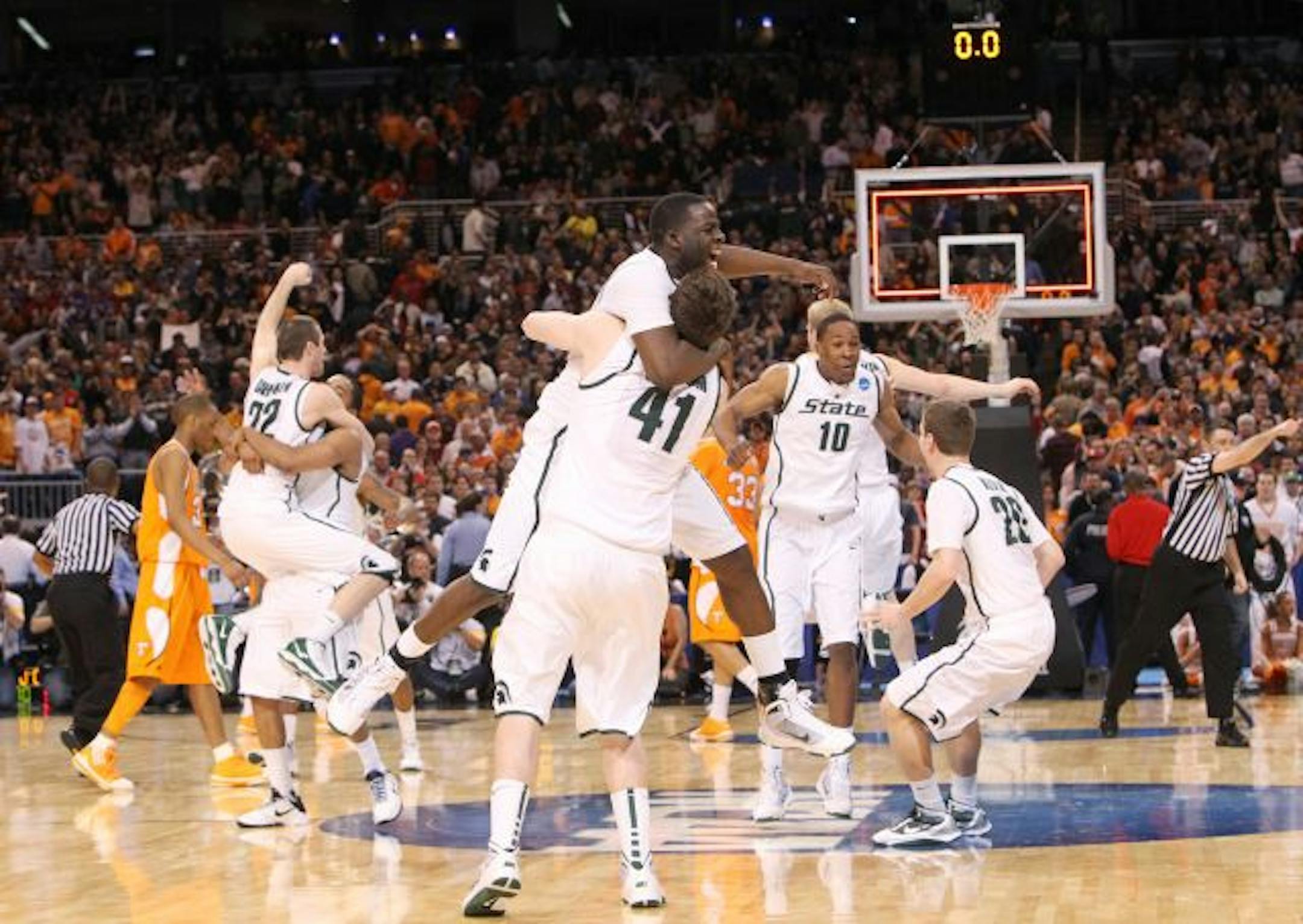 Michigan State players celebrated after defeating Tennessee, 70-69, in the Midwest regional final of the men's NCAA basketball tournament on Sunday.