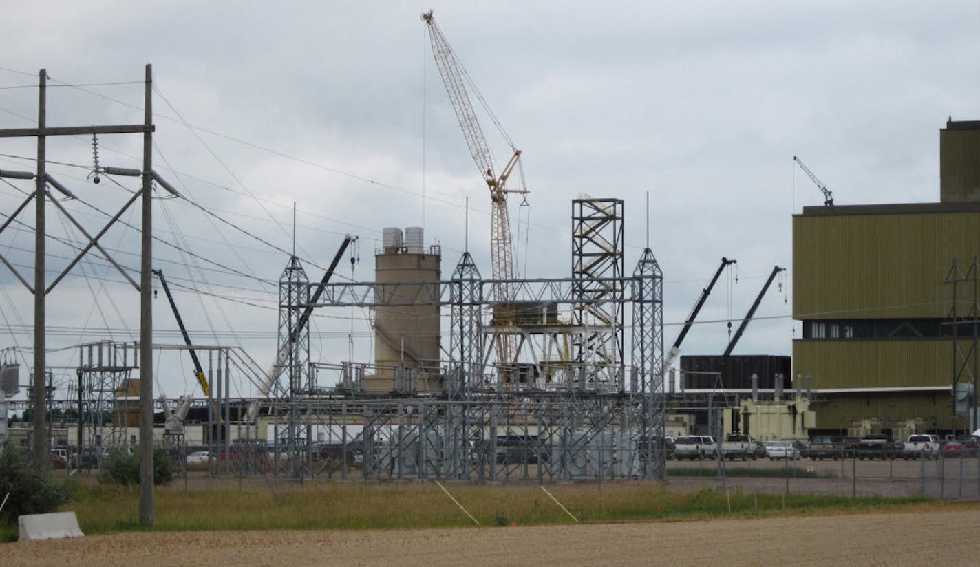 The largest of several cranes towers over the site of a $405 million pollution-control project at the coal-fired Big Stone power plant in South Dakota,