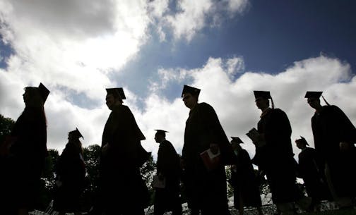 FILE - In this Friday, May 12, 2006, file photo, university students in their caps and gowns are silhouetted as they line up for graduation ceremonies in Lawrenceville, N.J. Students drop out of college for a mix of personal, financial and academic reasons, but there are resources for those who want to finally earn a degree.
