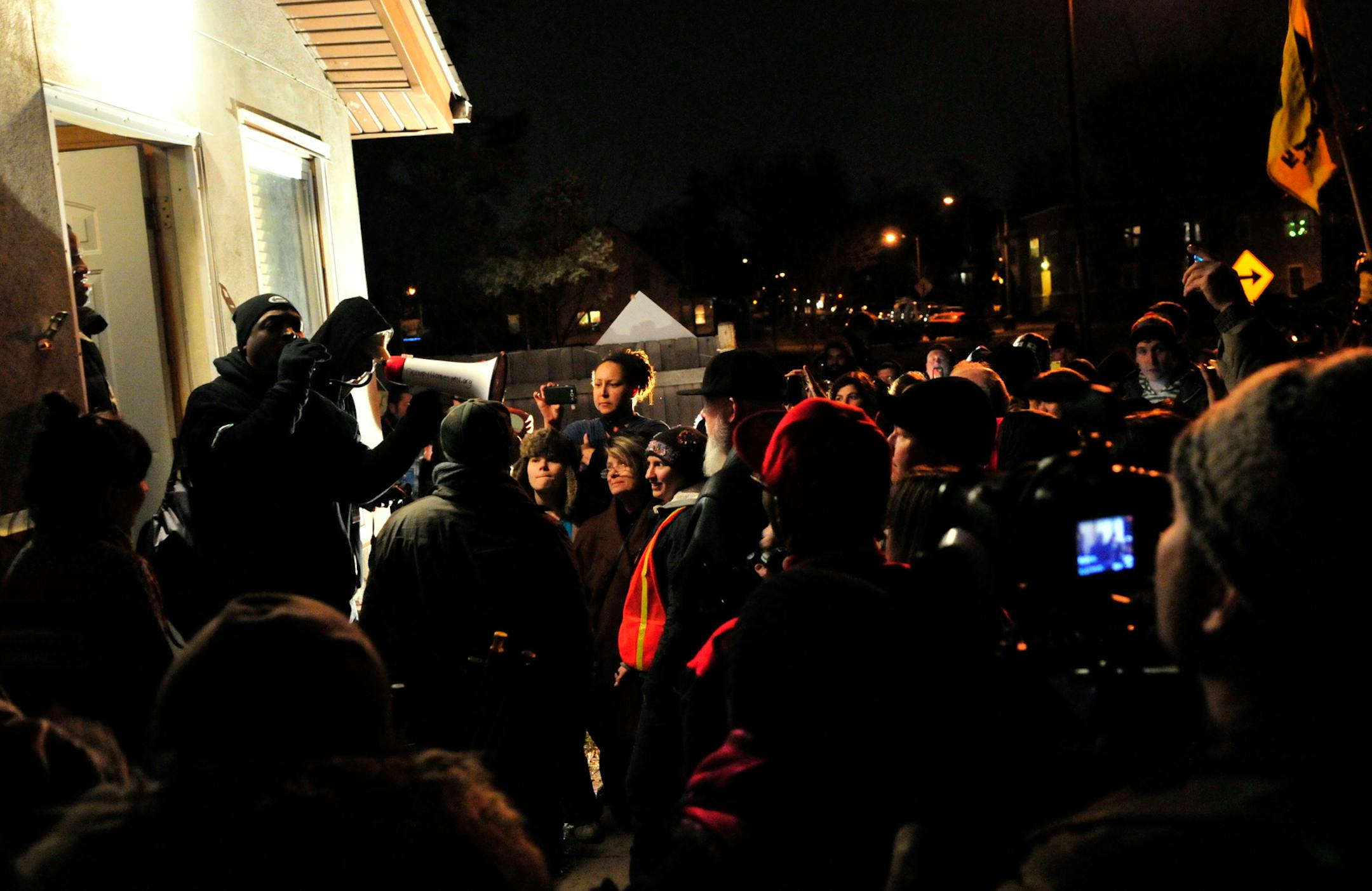 At the invitation of Brother Ali, right, Chuck D spoke during an Occupy Homes rally in south Minneapolis.
