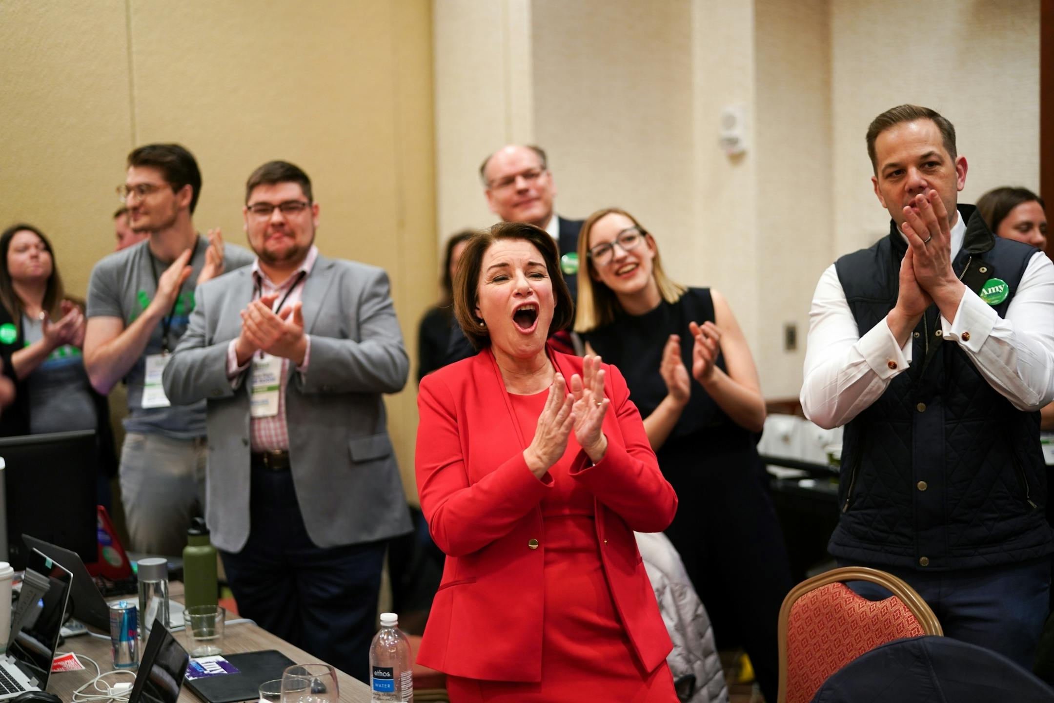 With campaign manager Justin Buoen at her side, Amy Klobuchar greeted almost 100 staffers gathered in the war room behind the stage in Des Moines. She called many out by name and thanking them for all their hard work.