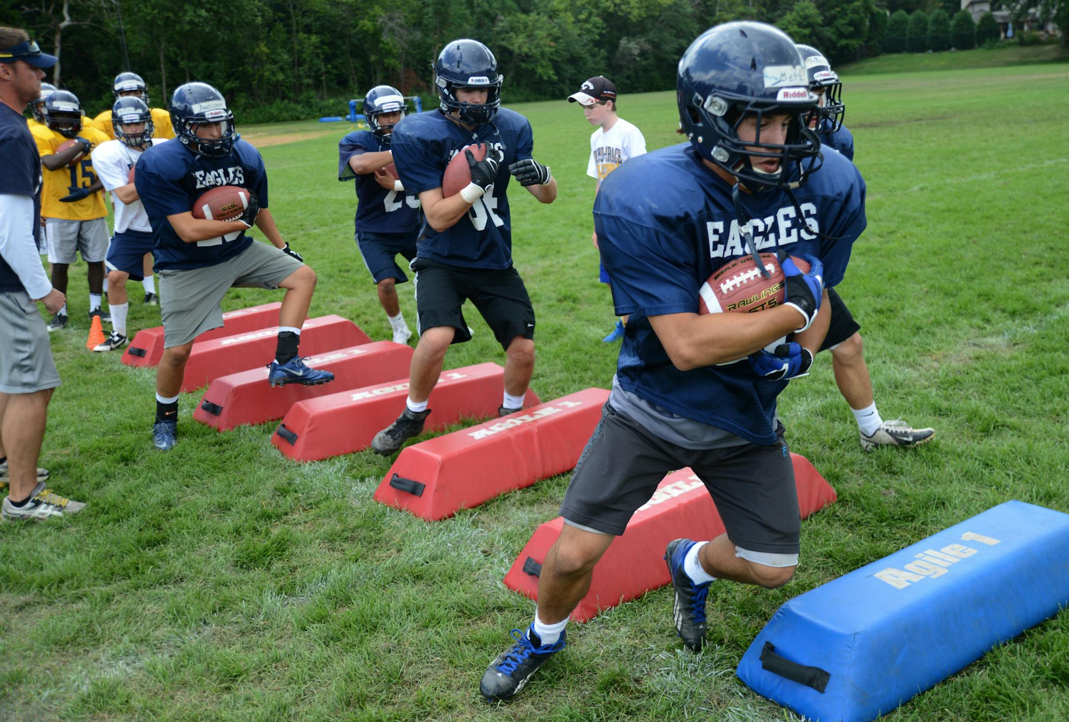 Defending Class 5A champ Totino-Grace is preparing to move up to Class 6A.] Richard.Sennott@startribune.com Richard Sennott/Star Tribune Fridley Minnesota Friday 8/16/13) ** (cq)