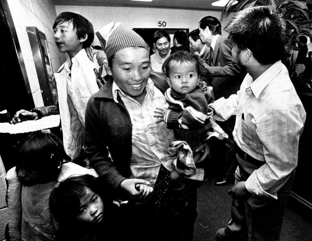 A Hmong family arrived at Minneapolis-St. Paul Airport in 1981 after leaving a refugee camp in Thailand.