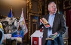 Gov. Tim Walz discussed some of the books banned elsewhere that are going into the Little Free Library outside his office at the State Capitol.