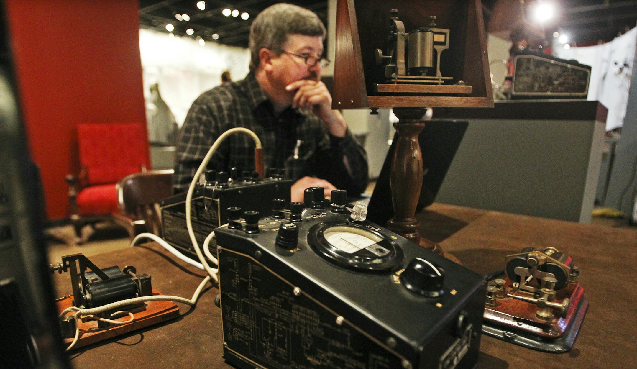 Jim Wades, president of the Morse Telegraph Club, works to link a computer program to telegraph parts for the new Civil War exhibit opening soon, seen Friday, Feb. 22, 2013, at the Minnesota History Museum in St. Paul, MN.] (DAVID JOLES/STARTRIBUNE) djoles@startribune.com Friday, Feb. 22, 2013, at the new Civil War exhibit opening soon at the Minnesota History Museum in St. Paul, MN.**Jim Wades,cq