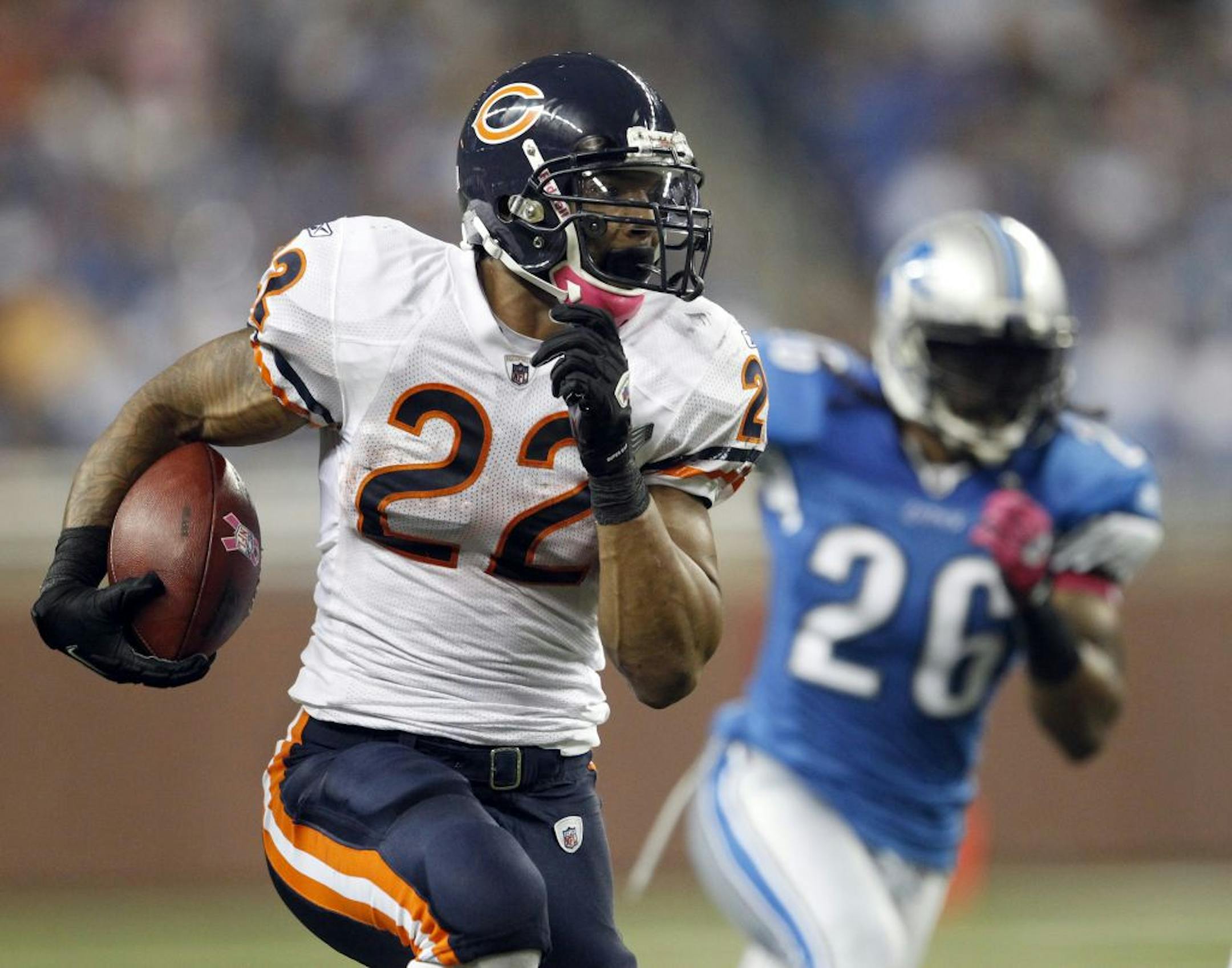 Chicago Bears running back Matt Forte (22) runs the ball after a pass reception against the Detroit Lions free during the second quarter Monday, October 10, 2011 at Ford Field in Detroit, Michigan.