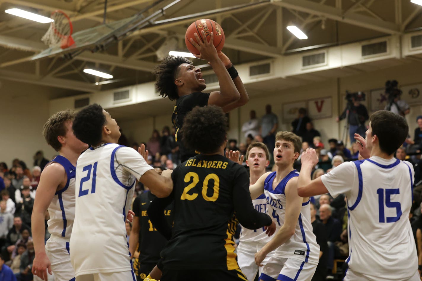 DeLaSalle's Nasir Whitlock through a crowd of defenders in the lane and scores on a short jump shot late in the game. Photo by Cheryl A. Myers, SportsEngine