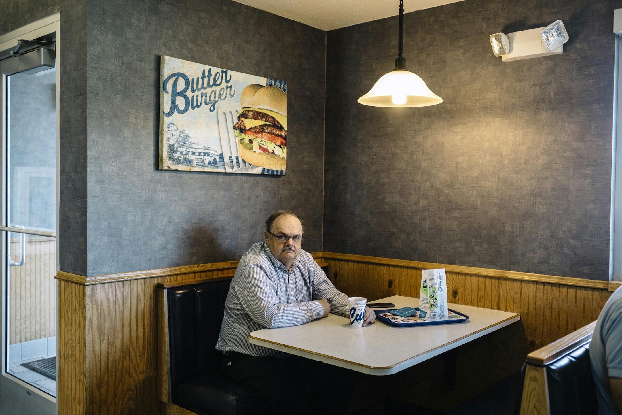 John Palmer on May 16, 2019, at Culver's restaurant in St. Cloud, Minn., where he reads right-wing news and conspiratorial websites each weekday. As more Somali refugees arrive in St. Cloud, white anti-immigration activists have pressed an increasingly explicit anti-Muslim agenda. (William Widmer/The New York Times)
