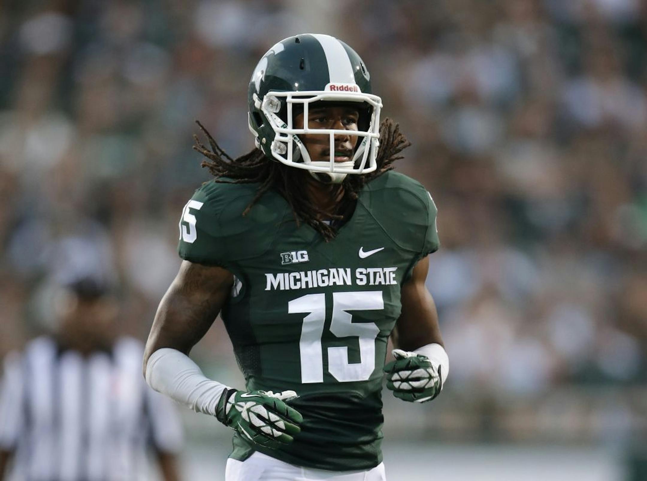 Michigan State cornerback Trae Waynes (15) runs against Jacksonville State in the first half of a NCAA college football game in East Lansing, Mich., Friday, Aug. 29, 2014.