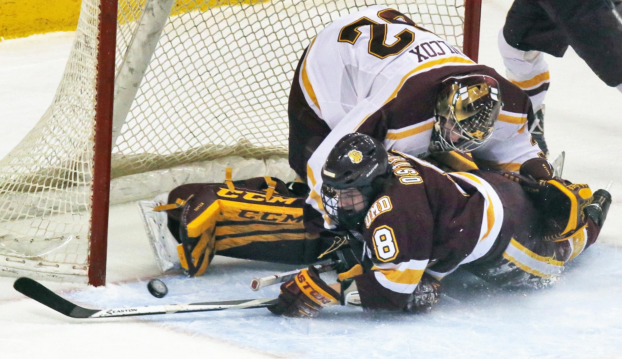 Minnesota Gophers vs. Minnesota Duluth Bulldogs. Bulldogs Kyle Osterberg trie to no avail to slip the puck past Gophers goalie Adam Wilcox in first period action. (MARLIN LEVISON/STARTRIBUNE