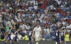Real Madrid's Gareth Bale reacts as Valladolid's Sergi Guardiola celebrates after scoring his side's first goal during a Spanish La Liga match between