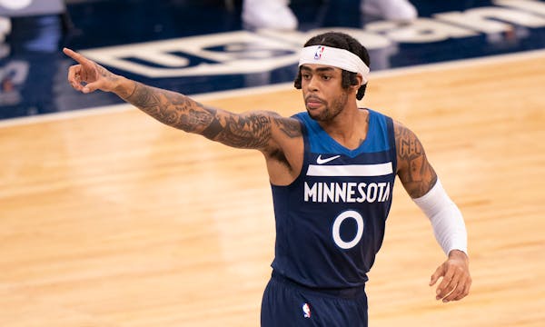 Minnesota Timberwolves guard D'Angelo Russell (0) pointed to a teammate after hitting a three point shot in the first quarter against Orlando. ] JEFF 