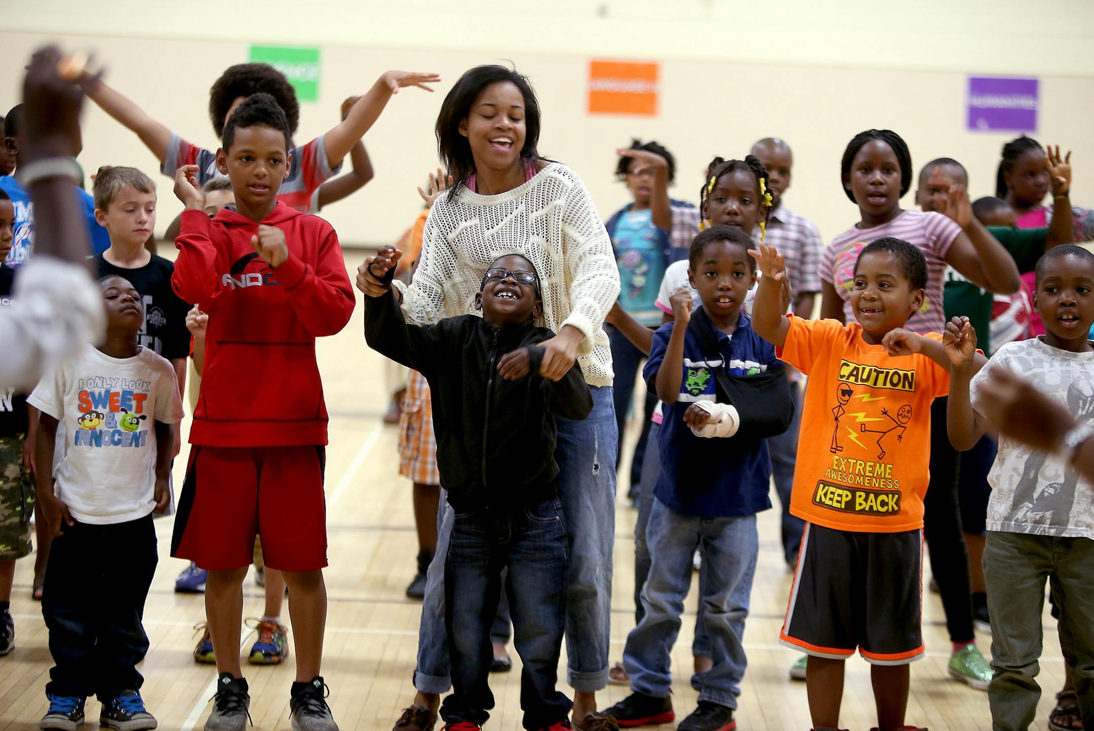 Melanie Hill, a U of M student, joined students during a morning program at North View Junior High, Tuesday, July 1, 2014 in Brooklyn Park, MN. Osseo launched a new summer school program that aims to boost students' literacy skills while deeply involving community members. The program is paid through the Chldren's Defense Fund and is part of the district's plan to help at-risk, minority students. ] (ELIZABETH FLORES/STAR TRIBUNE) ELIZABETH FLORES • eflores@startribune.com