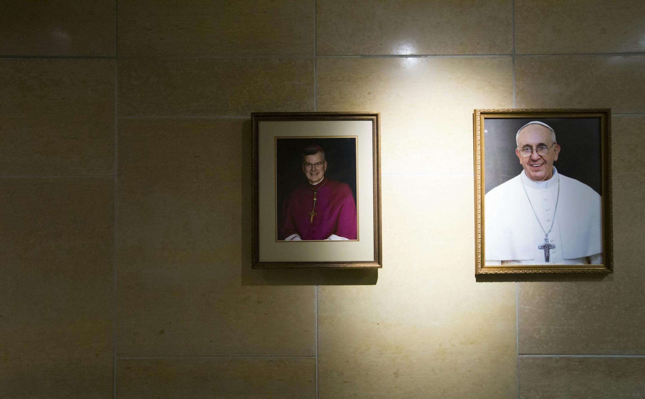 A picture of Archbishop John Nienstedt hung on the wall next to Pope Franscis at Saint Olaf Catholic Church on Friday, January 16, 2015, in Minneapolis, Minn. ] RENEE JONES SCHNEIDER • renee.jones@yahoo.com