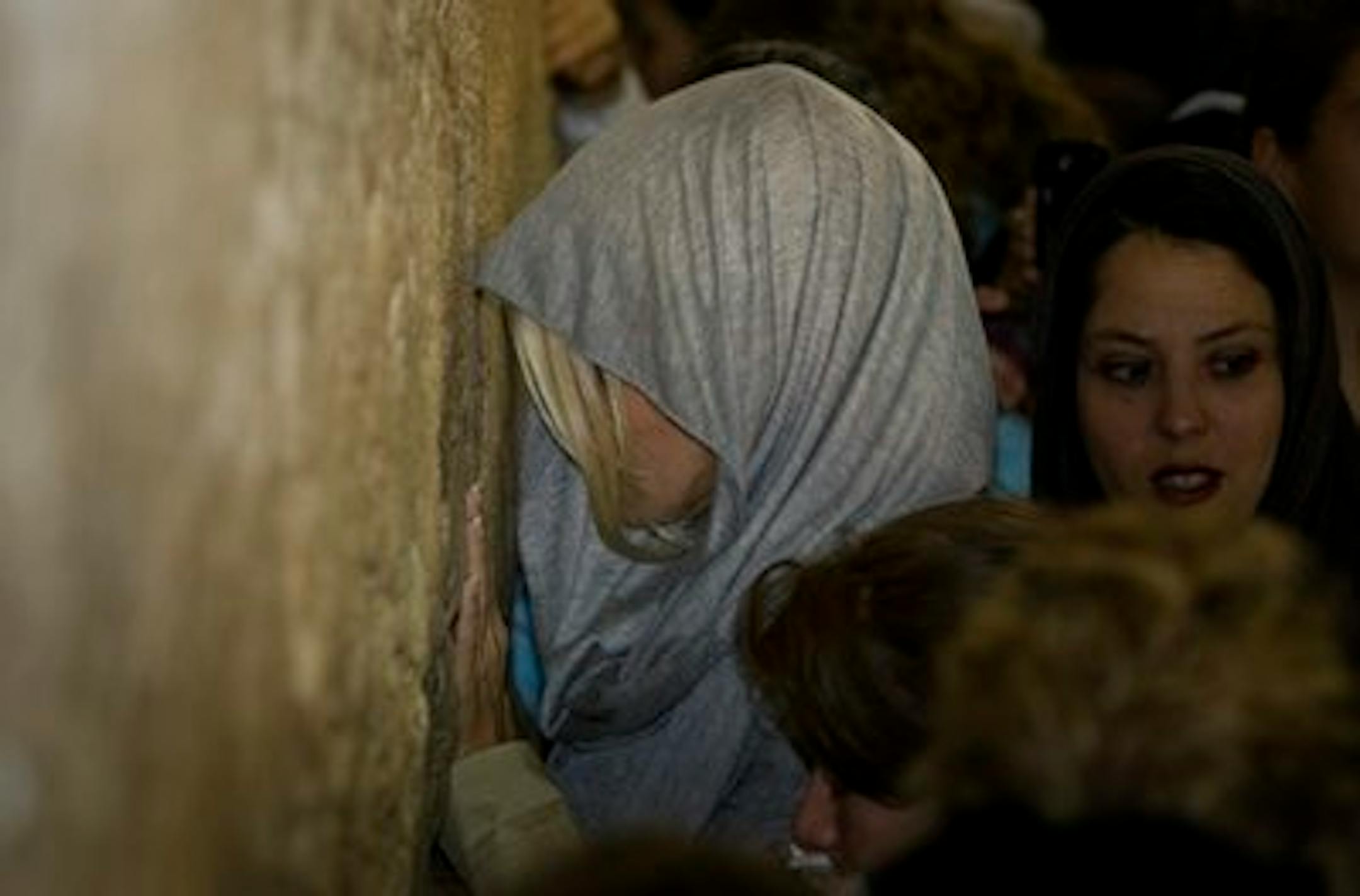 U.S. actress Pamela Anderson prays at the Western Wall, Judiasm's holiest site, in Jerusalem's Old City, Sunday, Nov. 7, 2010.  Former "Baywatch" star Anderson said Sunday she will try her powers of seduction while in Israel on an unlikely audience - ultra-Orthodox Jewish lawmakers. Anderson, an honorary director of People for the Ethical Treatment of Animals, is in Israel to participate in the local version of "Dancing with the Stars." (AP Photo/Sebastan Scheiner)