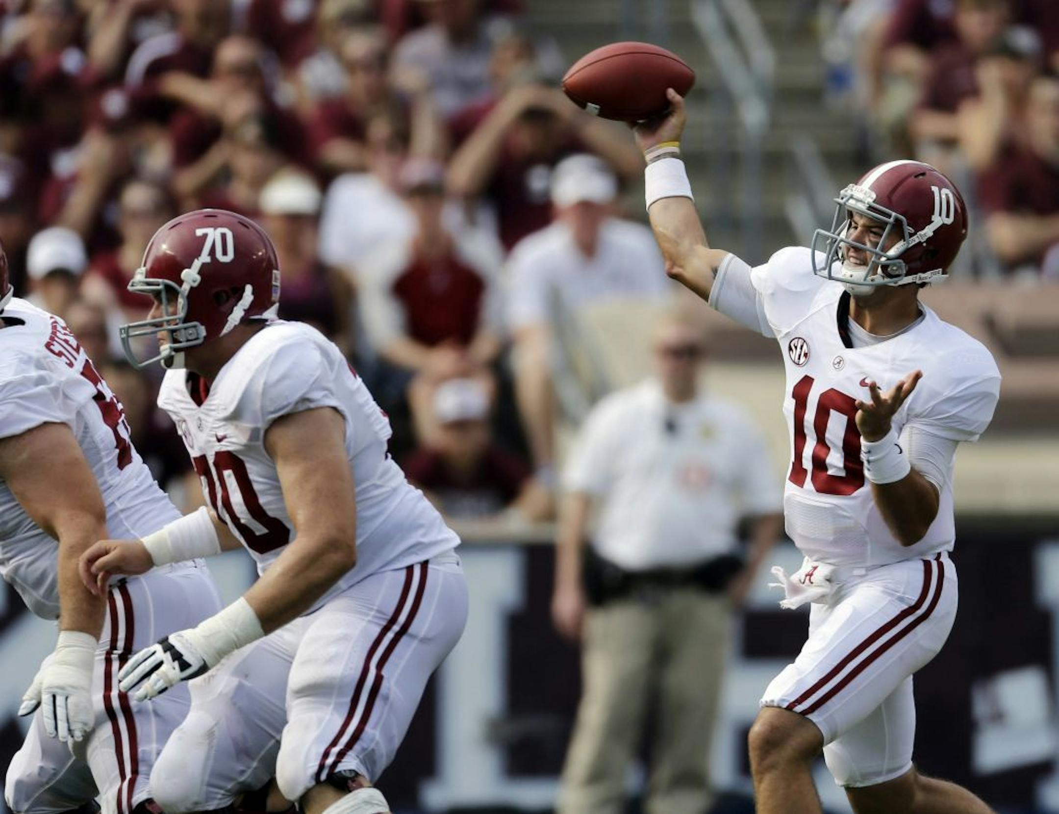Alabama quarterback AJ McCarron (10) passes against Texas A&M during the third quarter of an NCAA college football game Saturday, Sept. 14, 2013, in College Station, Texas.