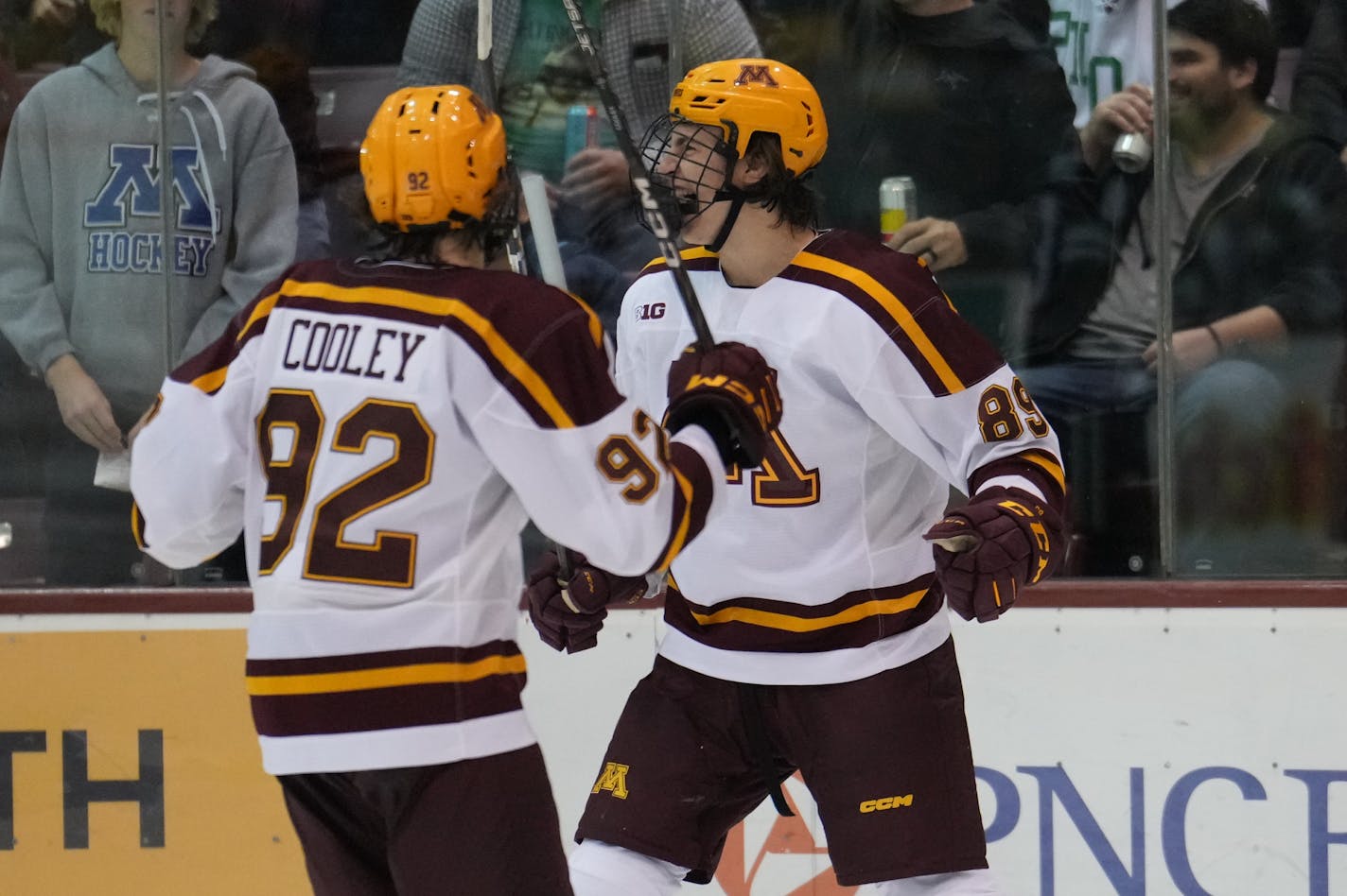 The Gophers Matthew Knies (89) celebrated with Logan Cooley after scoring against North Dakota on Saturday night, Oct. 22, 2022, at 3M Arena at Mariucci in Minneapolis. (University of Minnesota photo)