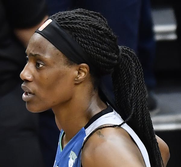 Minnesota Lynx center Sylvia Fowles (34) and guard Seimone Augustus (33) were dejected after their team's 77-76 loss to the Los Angeles Sparks in game