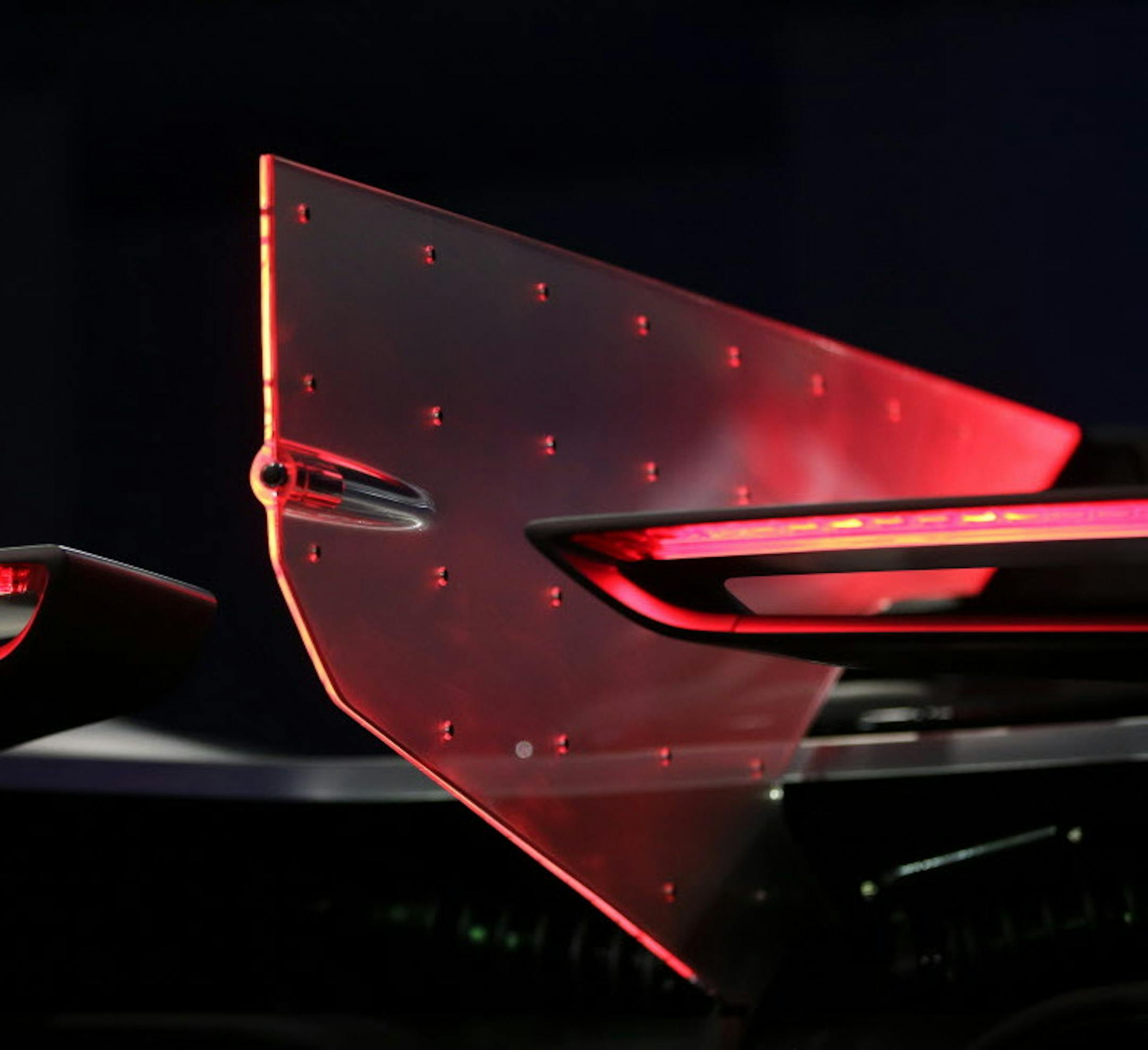 The taillights of the FFZero1 by Faraday Future is seen at CES Unveiled, a media preview event for CES International Monday, Jan. 4, 2016, in Las Vegas. The high performance electric concept car was unveiled during a news conference by Faraday Future. (AP Photo/Gregory Bull)