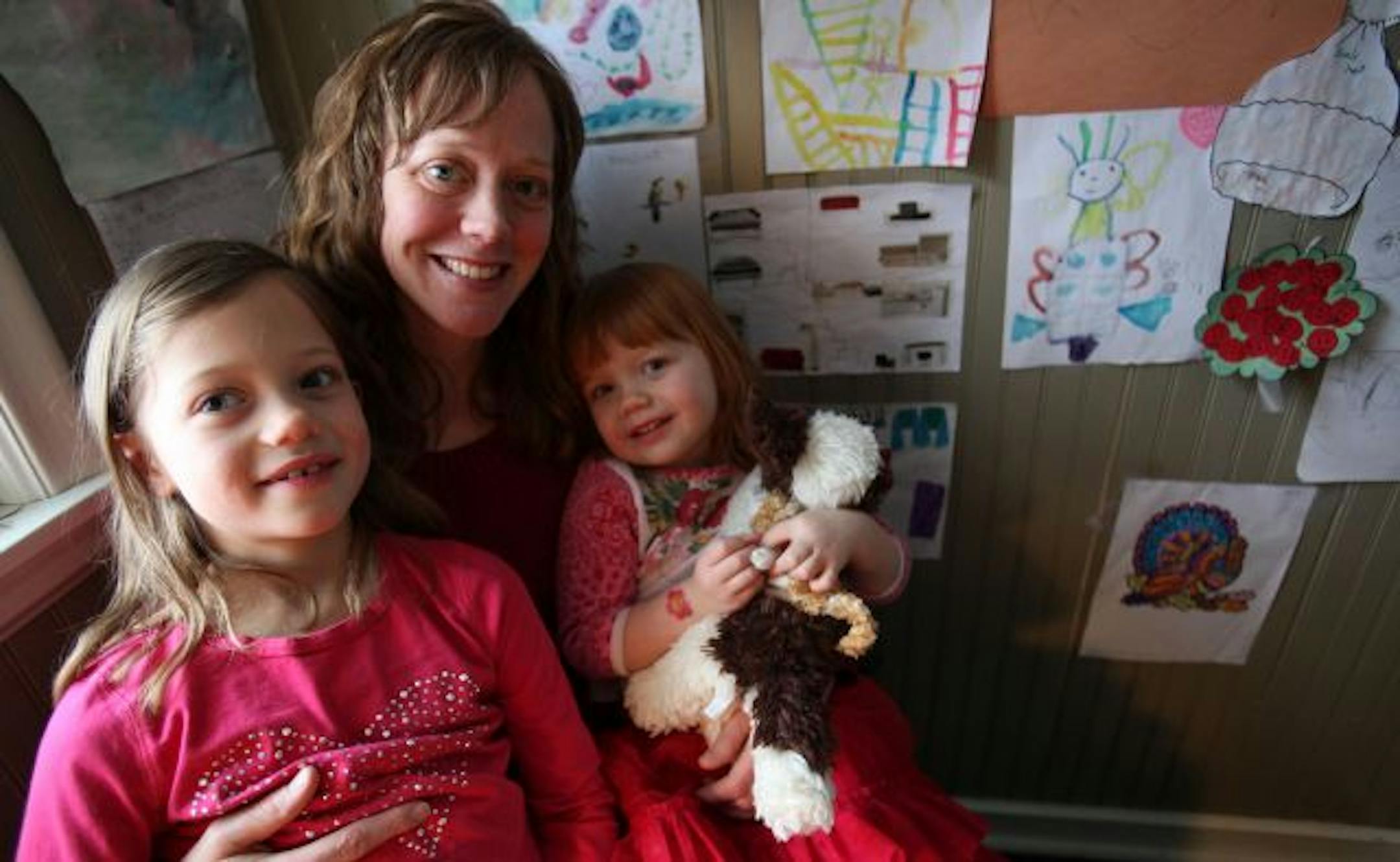 Kate Hopper held her two daughters Stella, 7, and Zoe, 2