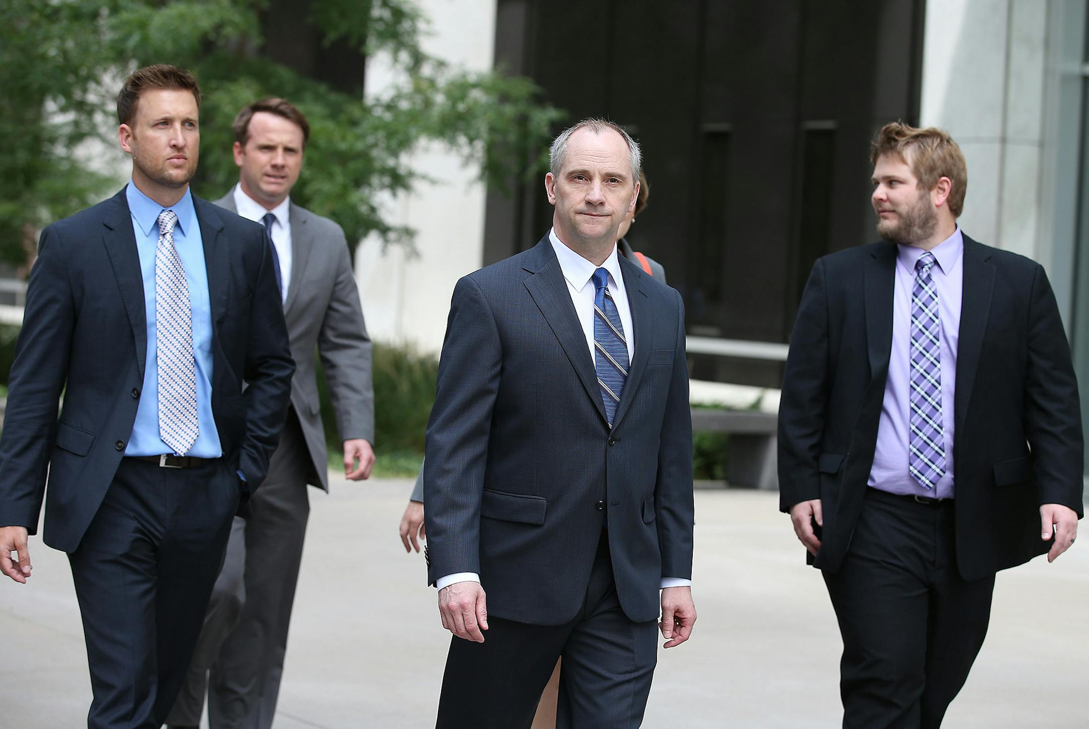 Legal eagles: Jesse Ventura&#x2019;s lawyers, including David Olsen at center, made their way out of the Warren E. Burger Federal Building to address the media Tuesday.