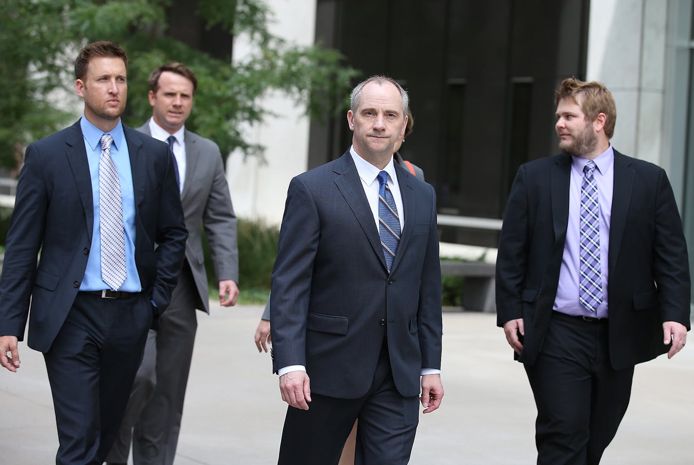 Legal eagles: Jesse Ventura&#x2019;s lawyers, including David Olsen at center, made their way out of the Warren E. Burger Federal Building to address the media Tuesday.