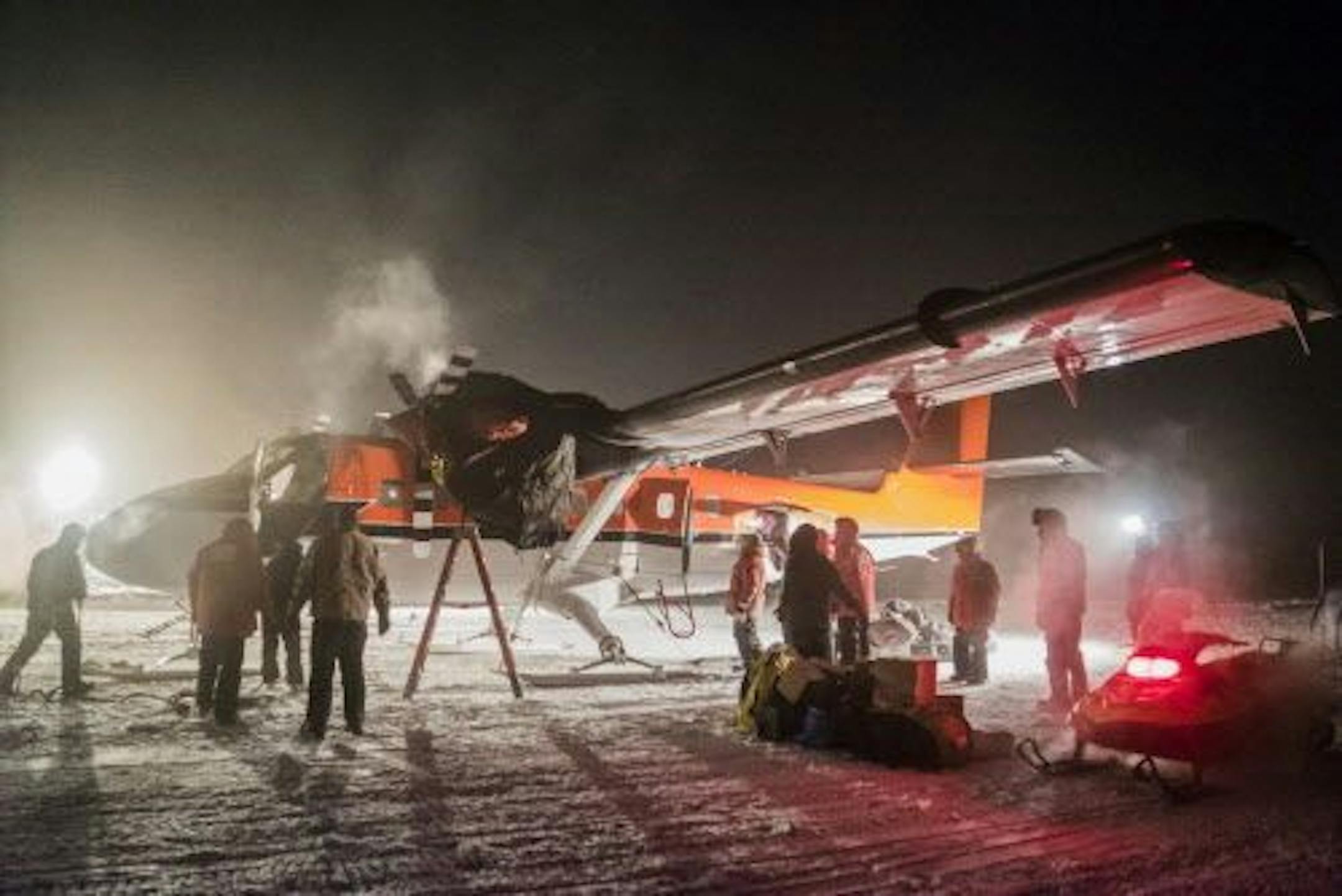 In this photo provided by the National Science Foundation, a small plane picks up a sick worker at the U.S. South Pole science station. Once the sick patient and the crew rest, they will then fly off Antarctica for medical attention that could not be provided on the remote continent.