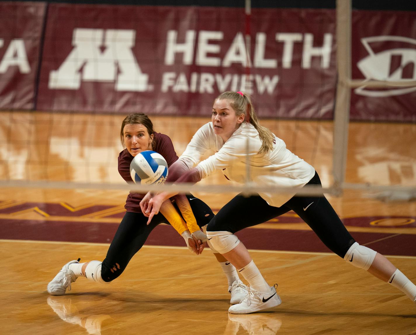 The Gophers Jenna Wenaas (2) reached for a dig in front of teammate CC McGraw (7) in the second game. ] JEFF WHEELER • jeff.wheeler@startribune.com