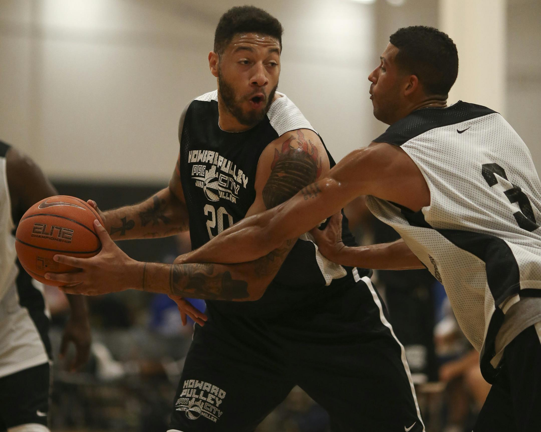 Former Hopkins standout and current NBA player now with the Philadelphia 76ers played in a Howard Pulley Basketball League game Monday night, July 15, 2013 at High Performance Academy in Eagan. Royce White protected the ball from the defense of Jefferson Mason during June Miller Time's game against Pat Madison Magic Monday night. ] JEFF WHEELER ‚Ä¢ jeff.wheeler@startribune.com