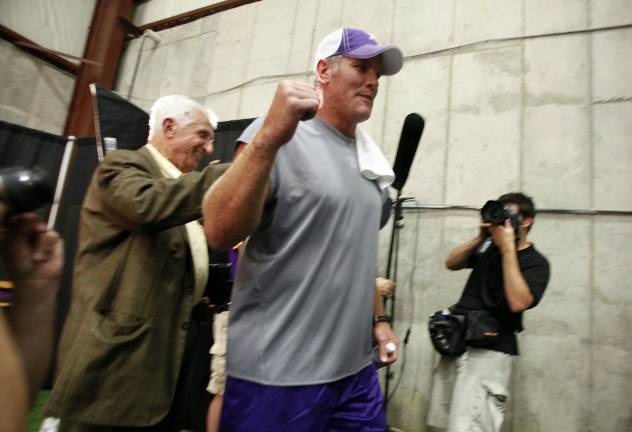 Favre walks off after belateded congratulating Star Tribune columnist Sid Hartman on turning 90 after the press conference.
