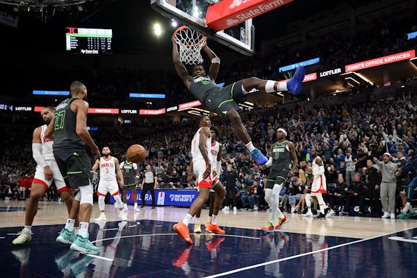 The Timberwolves' Anthony Edwards (5) dunks the ball against the Rockets in the fourth quarter Tuesday at Target Center.