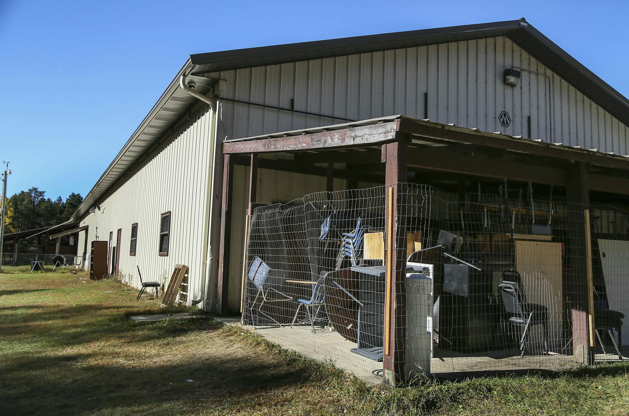 Bug-O-Nay-Ge-Shig High School was once a pole shed for vehicle maintenance and turned into a high school and is lacking much, including storage space. These chairs and desks were seen in an exterior storage space Tuesday, Oct. 21, 2014, in Bena, MN.](DAVID JOLES/STARTRIBUNE)djoles@startribune The Bug O Nay Ge Shig School is a culturally based alternative school that opened in 1975 with a mission of serving Ojibwe children and has matured into a fully accredited educational program. Bug School is