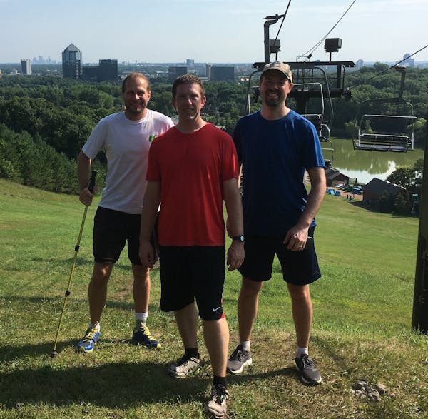 Three Twin Cities men, from left, Todd Millenacker, Casey Black and Peter Davich, on top of Mount Gilboa, a Bloomington ski hill they would climb 96 t