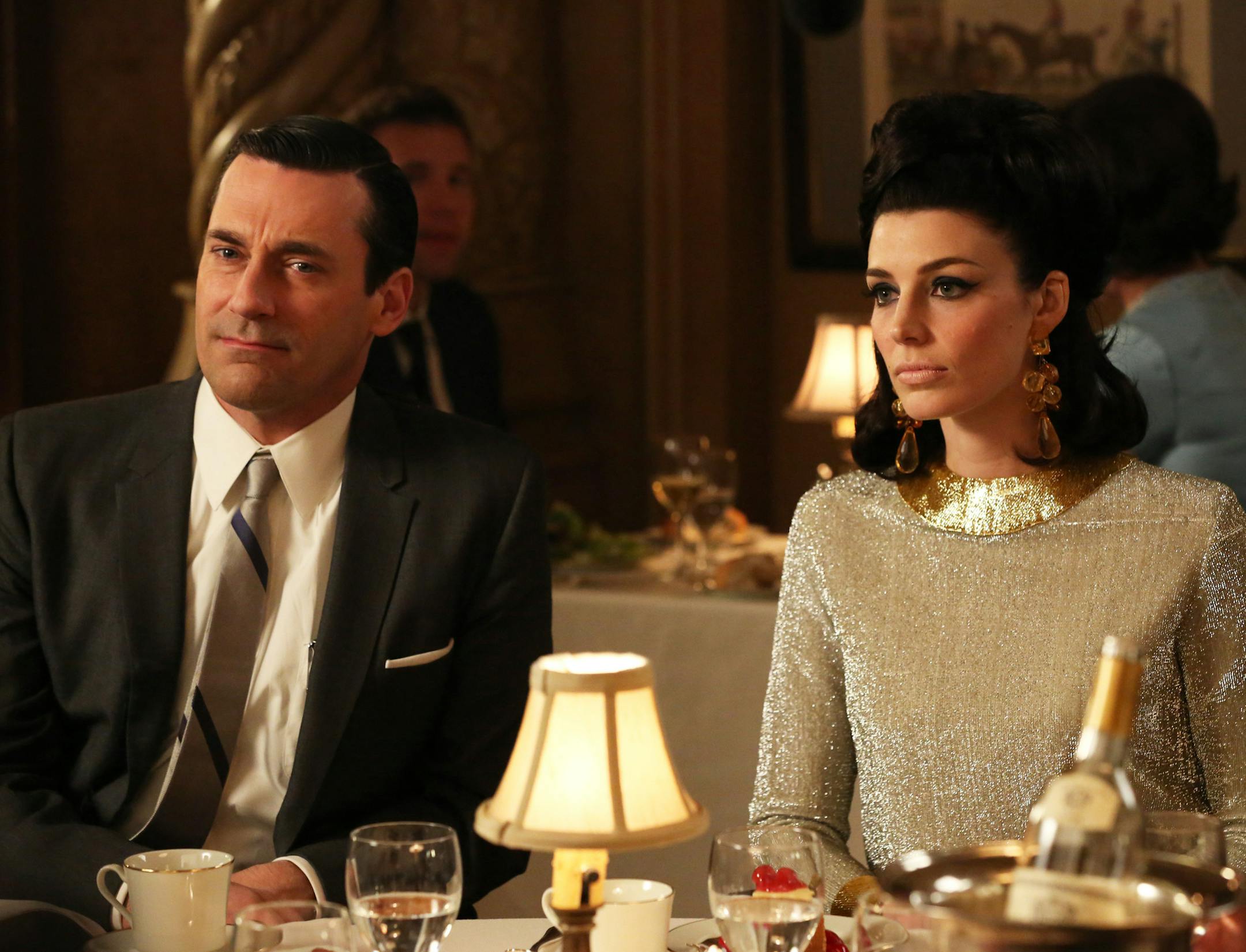 This TV publicity image released by AMC shows Jon Hamm as Don Draper, left, and Jessica Pare as Megan Draper in a scene from "Mad Men." The season finale airs Sunday, June 23, on AMC. (AP Photo/AMC, Michael Yarish)
