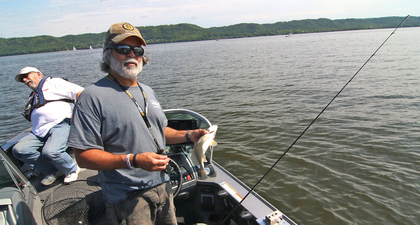 Don Pereira, the former fisheries chief for the state of Minnesota, joined a multi-species fishing club after his retirement to enjoy the company of fellow anglers. The Waterdogs have been around since 1982. Here he holds a drum, or sheepshead, caught during a laid-back club tournament held last weekend on Lake Pepin. It didn't count in the standings because it wasn't on the list of targeted fish.