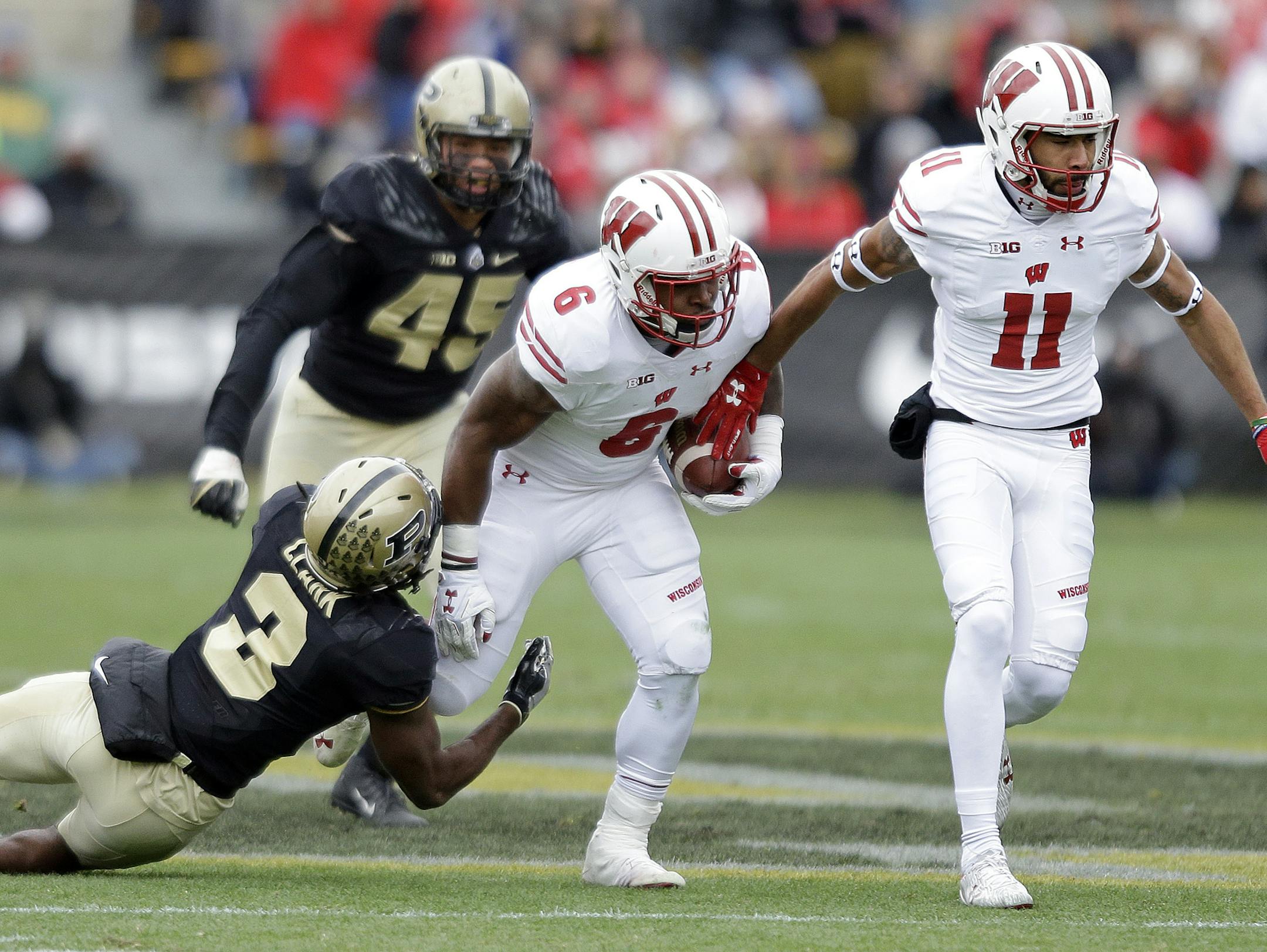 Wisconsin running back Corey Clement (6) is tackled by Purdue safety Leroy Clark (3) during the first half of an NCAA college football game in West Lafayette, Ind., Saturday, Nov. 19, 2016. (AP Photo/Michael Conroy) ORG XMIT: MIN2016112318130836