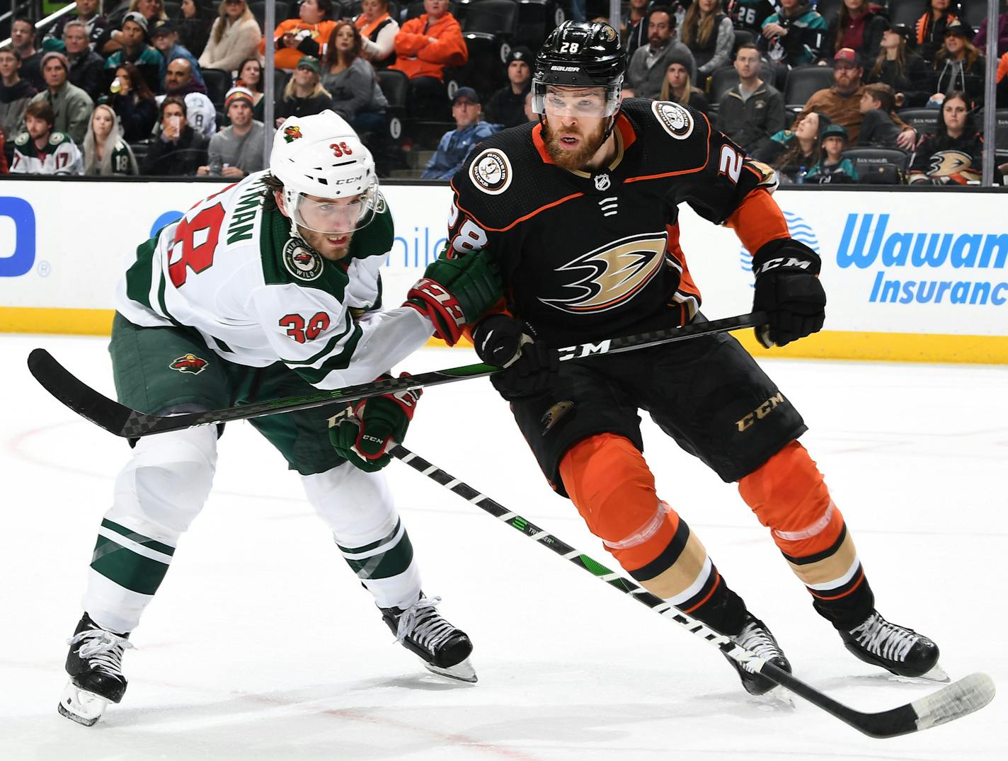 Jani Hakanpaa (28) of the Anaheim Ducks battles for position against Ryan Hartman (38) of the Minnesota Wild on Sunday, March 8, 2020 at Honda Center in Anaheim, Calif. (John Cordes/NHLI/Getty Images/TNS) ORG XMIT: 1603561