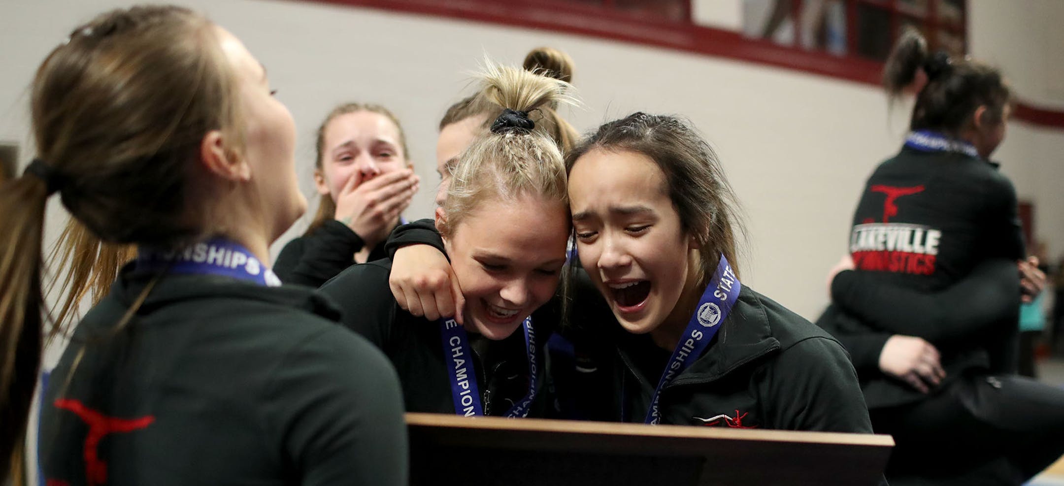 Minnesota state high school 2A gymnastics team title at Maturi Pavilion at the University of Minnesota in Minneapolis, MN. Here, Lakeville North team members celebrate their first place finish.] DAVID JOLES •david.joles@startribune.com Minnesota state high school 2A gymnastics team title at Maturi Pavilion at the University of Minnesota in Minneapolis, MN.]